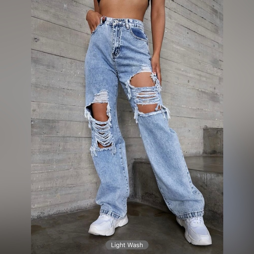 Light wash wide leg distressed jeans.